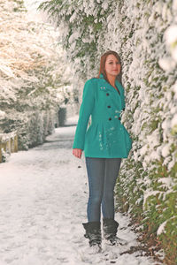 Portrait of a girl standing in snow