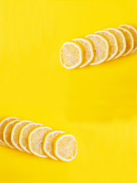 Close-up of bananas against yellow background