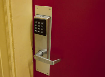 Close-up of telephone booth on wall