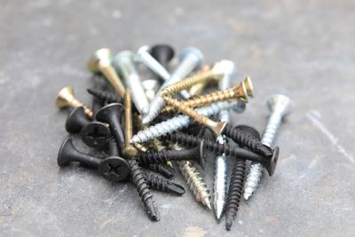 Close-up of screws on table