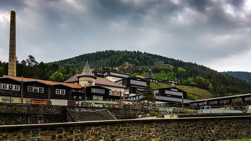 Mountain range against cloudy sky