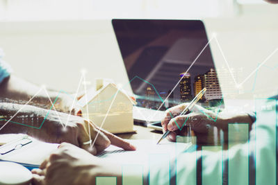Digital composite image of people working on mobile phone