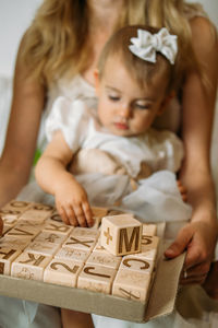 Close-up of cute girl holding toy basket