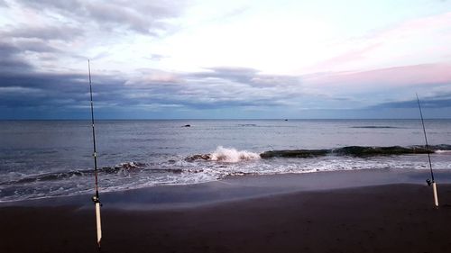 Scenic view of sea against cloudy sky