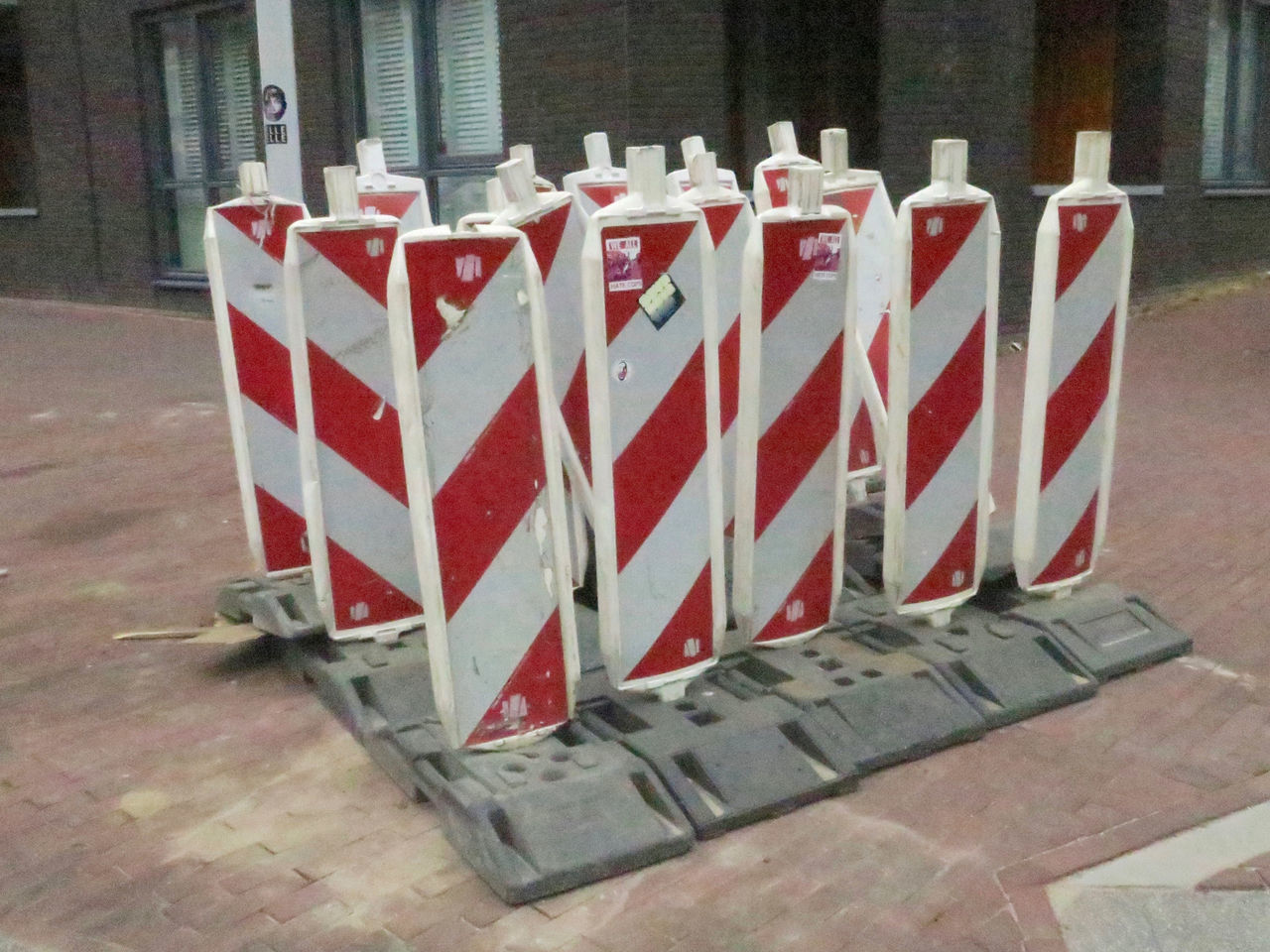 CLOSE-UP OF RED CHAIRS AND TABLES AT SIDEWALK