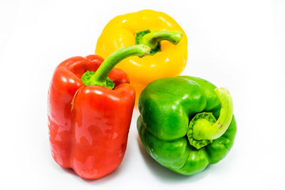 Close-up of bell peppers against white background