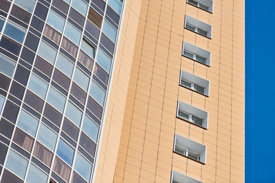 Low angle view of modern building against clear sky