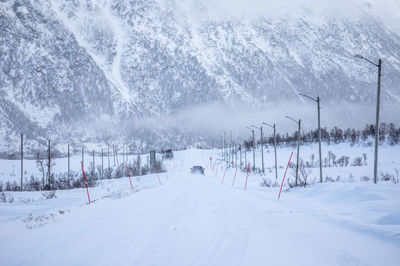 Scenic view of snow covered road