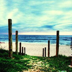 Scenic view of sea against cloudy sky