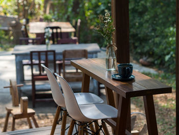 Empty chairs and table at restaurant