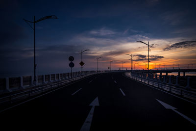 Street against sky during sunset