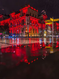 Illuminated buildings in city at night