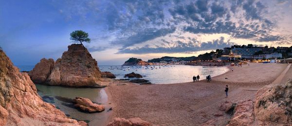 Panoramic view of sea and rocks against sky