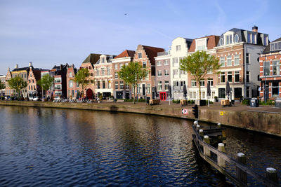 Haarlem, netherlands. traditional dutch houses lining the river sparne  in springtime.