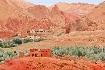 Buildings against mountain range