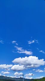 Low angle view of clouds against blue sky