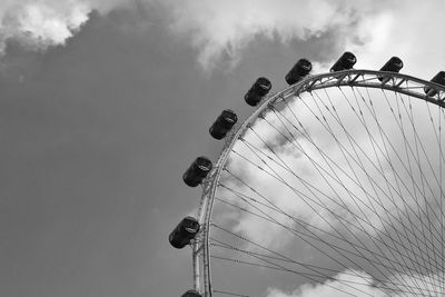 Low angle view of ferris wheel against sky