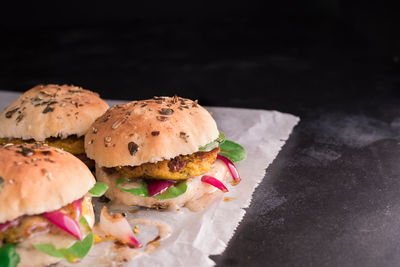 Close-up of burger against white background