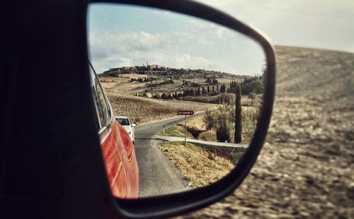 Scenic view of landscape seen through car window