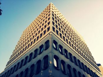 Low angle view of office building against sky