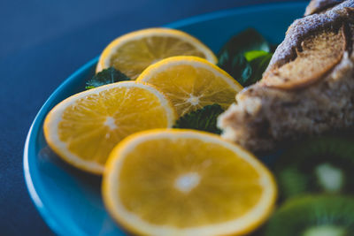 Close-up of lemon slice in plate