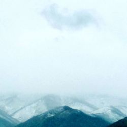 Scenic view of mountains against sky during winter