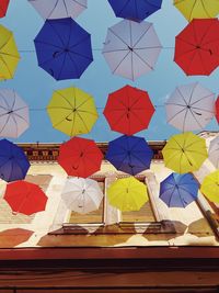 Multi colored umbrellas hanging on clothesline