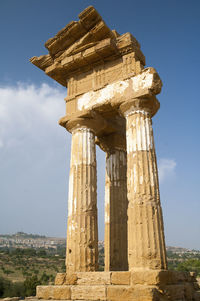 Low angle view of old ruins against sky