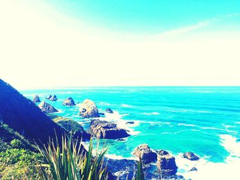 Scenic view of sea against blue sky