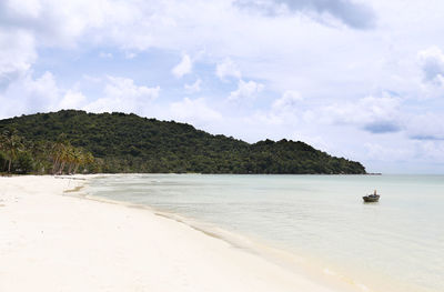 View of calm beach against the sky