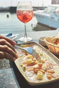 Tasting a delicious fish ceviche tiradito de pescado, summer food