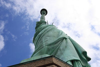 Low angle view of statue against cloudy sky