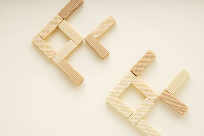 High angle view of objects on table against white background