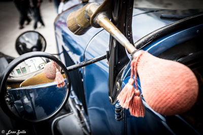 Close-up of man holding car