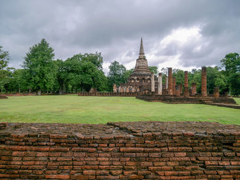 View of old building against cloudy sky