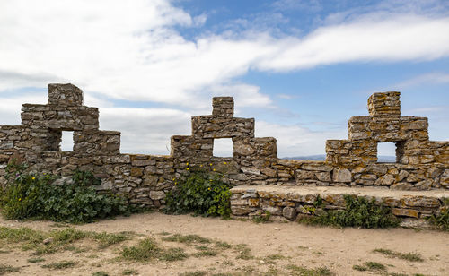 Old ruin building against cloudy sky