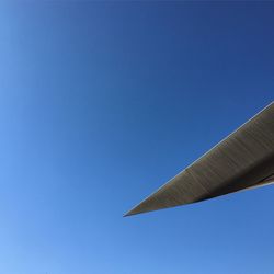 Low angle view of built structure against clear blue sky