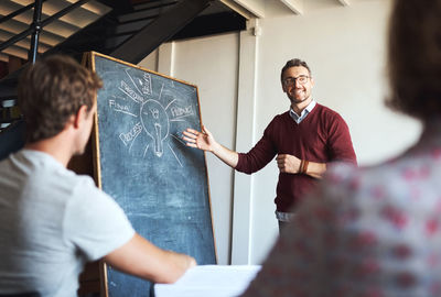 Businessman explaining strategy to colleagues