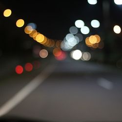 Defocused image of illuminated lights at night