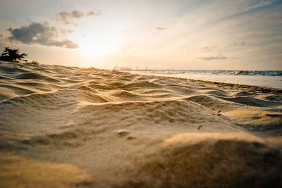 Scenic view of beach against sky during sunset