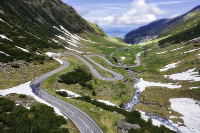 High angle view of road amidst mountains against sky