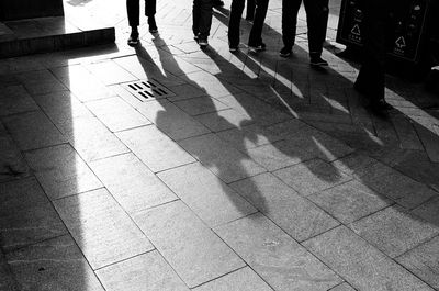 Low section of people walking on footpath