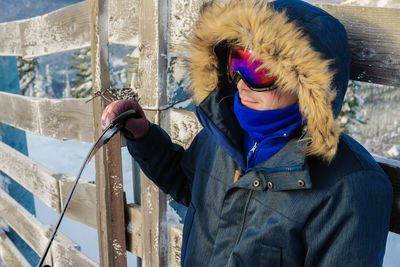 Man wearing warn clothing while standing outdoors during winter