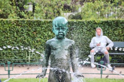 Sculpture of buddha statue in park