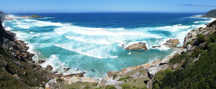 Scenic view of sea against blue sky