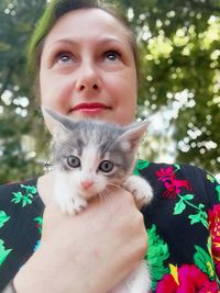 Portrait of woman with cat