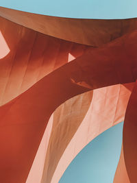 Low angle view of multi colored umbrella against sky