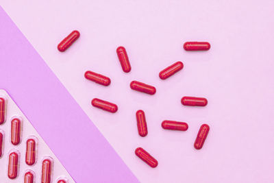 High angle view of pills on blue background