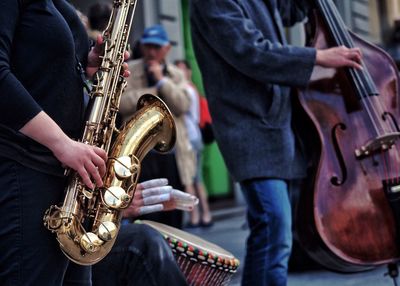 People playing guitar on street