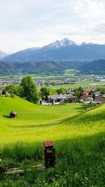 Scenic view of landscape and mountains against sky